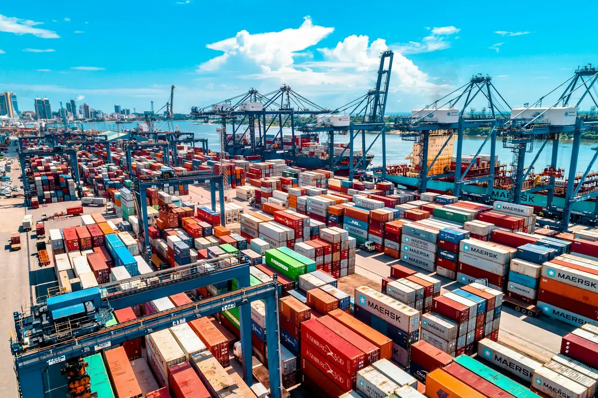 Container port with cranes and stacked containers