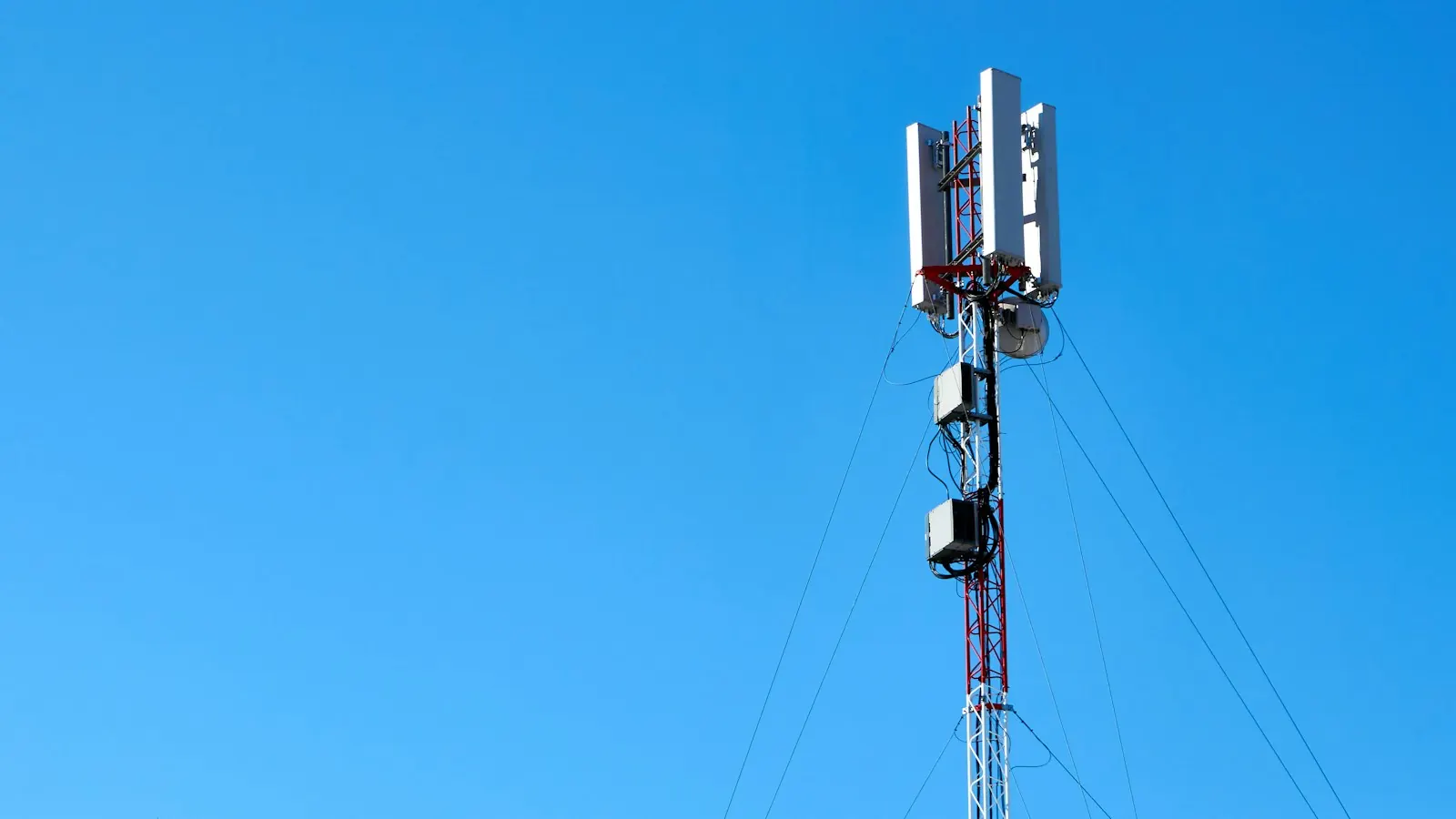 Cell tower against a blue sky
